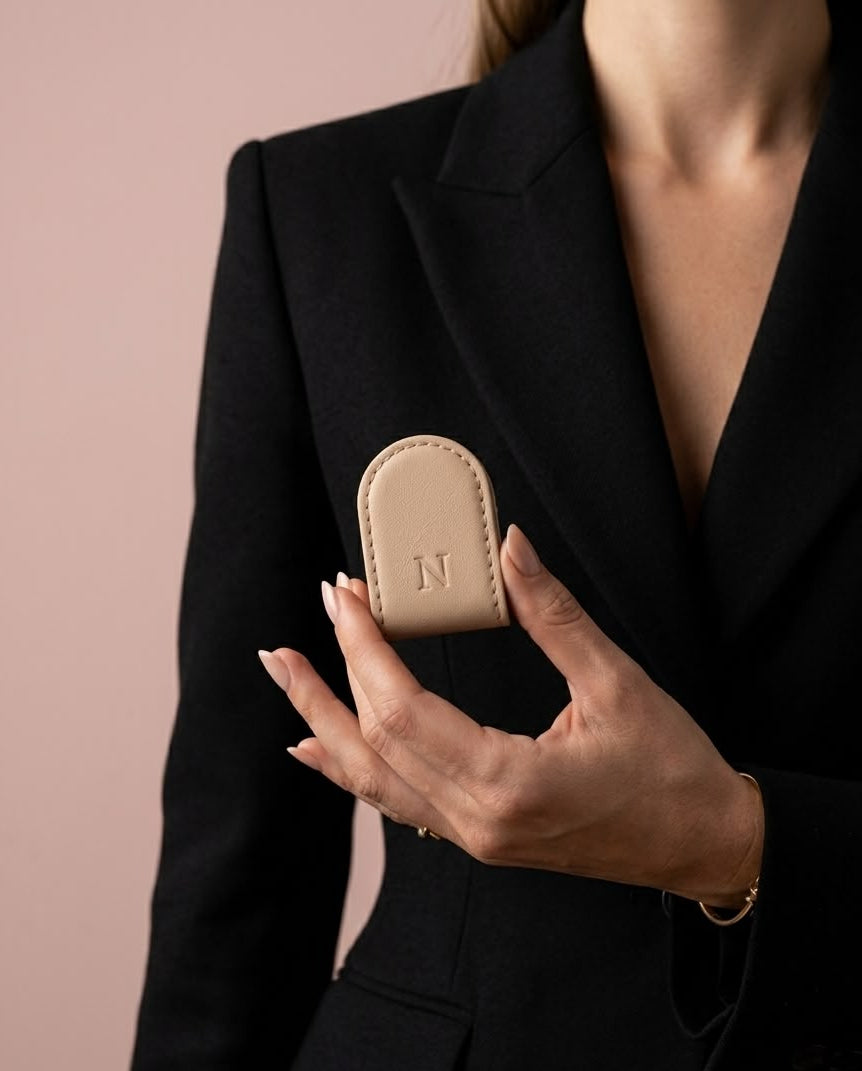 NAYL Magnetic Clipper Sand Beige held against a black blazer